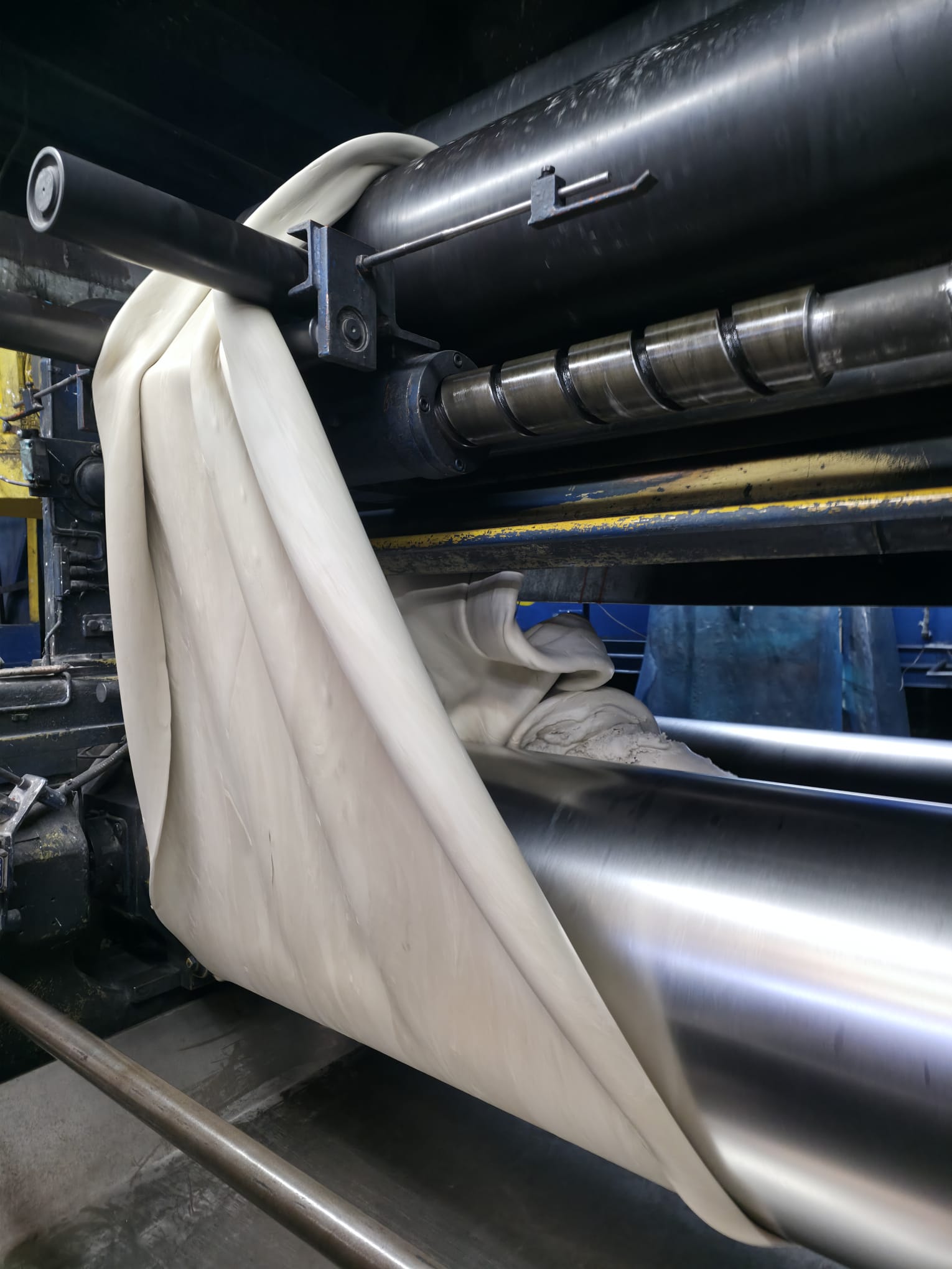 Pallets with uncured rubber in anti-adhesive sheet ready for elastomer contract manufacturing