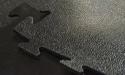 Puzzle-type rubber flooring for gyms and training areas